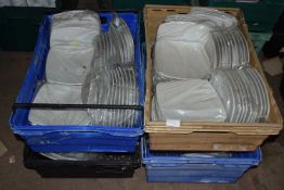 Four crates containing a large quantity of 8 inch square dinner plates