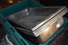 Six stainless steel serving trays