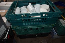 Three crates of mixed china and glass ware to include coffee cups, milk jugs, serving jugs etc