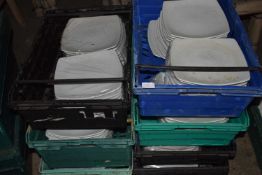 Seven crates containing a large quantity of 10 inch square dinner plates