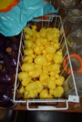 Basket containing a quantity of rubber ducks, paddling pool (hook a duck game)