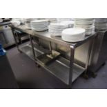 A large stainless steel work station, width 210 cm, height approx 88 cm, depth 60 cm
