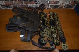 Mixed Lot: Various vintage horse brasses on leather straps and blinkers and other items