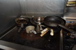 Mixed quantity of cast frying pans