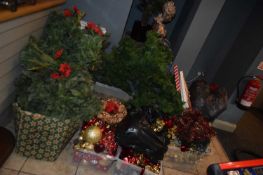 Large quantity of Christmas decorations together with Christmas trees, garlands etc