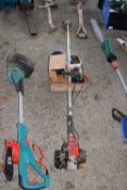 Petrol strimmer together with a box of various attachments and spares