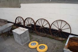 Four vintage iron horse cartwheels