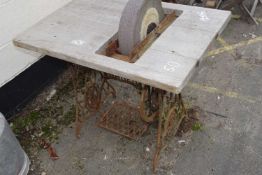 Vintage Singer sewing machine base adapted to carry a sharpening stone
