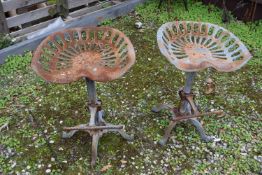 Pair of cast iron bar stools, height approx 65cm