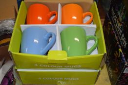 Two boxes of four coloured mugs