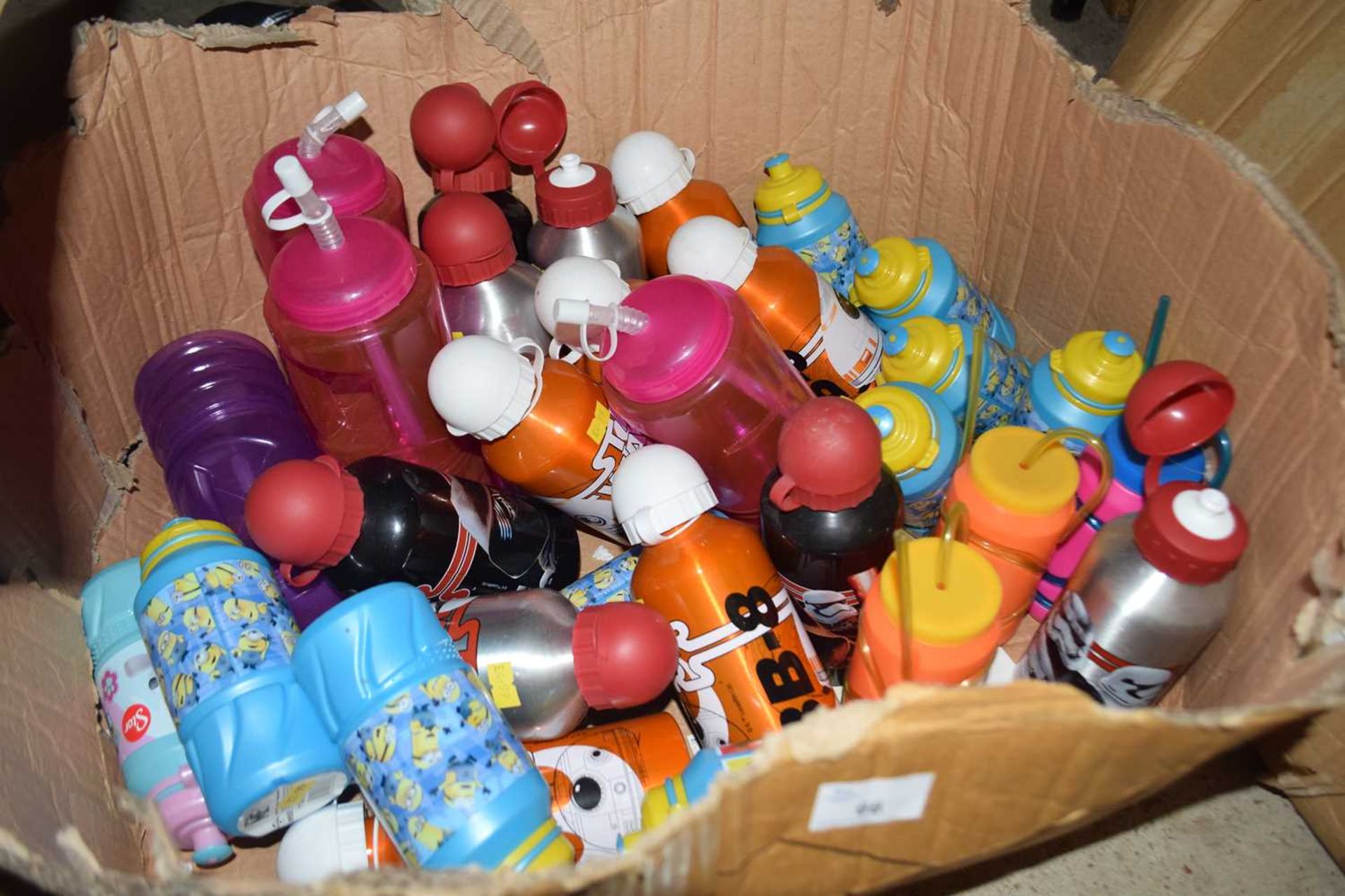 Large box containing a mixture of branded Minions, Star Wars, Paw Patrol bottles etc