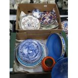 A collection of ceramic plates and chargers includ