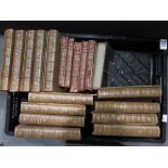 A collection of leather bound volumes including wo