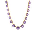 A late Victorian yellow metal amethyst riviere necklace