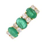 A 14ct gold emerald and diamond dress ring