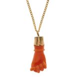 A late 19th century gold, coral figa pendant