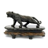 A Japanese bronze study of a prowling tiger, Meiji period, 1868-1912, open mouth, all-over dark