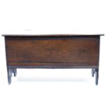 A 17th Century country oak plank chest, circa 1660, moulded and chip carved top and sides with