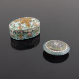 A Russian silver cloisonne enamel pill box, of oval form with double headed eagle to the cover on