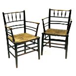 Philip Webb for William Morris & Co, a near pair of ebonised ash Sussex armchairs