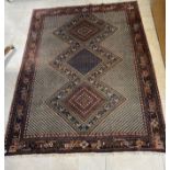 A Persian Khamseh rug, 143 by 193cm