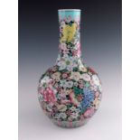 A Chinese bottle vase, 20th Century, famille rose decoration with chrysanthemum and other flowers,