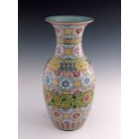 A 19th Century Chinese baluster vase, decorated in coloured enamels in the famille rose palette with