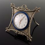 A Russian silver engine turned easel travel timepiece, late 19th Century, white enamel dial with
