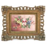 A 19th century English porcelain plaque wall, painted with a still life study of flowering