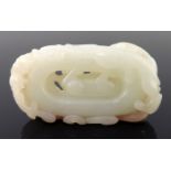 A Chinese pale jade carving, reticulated with a dog, scroll border, width 6cm