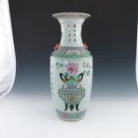 A 19th Century Chinese baluster vase, moulded lion mask and ring handles painted in polychrome in