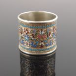 A Russian silver cloisonne enamel napkin ring, scrollwork design within a beaded border, struck