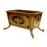 A Regency design mahogany wine cooler, of sarcophagus form with cast metal scroll side handles,