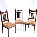 Wylie and Lochhead (attributed), three Arts and Crafts Glasgow School mahogany chairs
