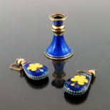 A Continental silver gilt and blue enamel miniature candlestick, French import marks, splayed