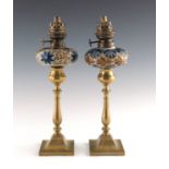 Two Royal Doulton stoneware and brass oil lamps