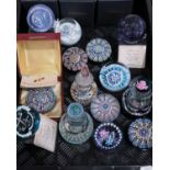 A collection of paperweights including Caithness R