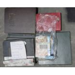 A collection of postcard albums and loose postcard