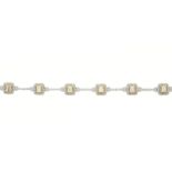 An 18ct gold diamond cluster line bracelet