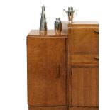 An Art Deco figured and birdseye maple cocktail cabinet