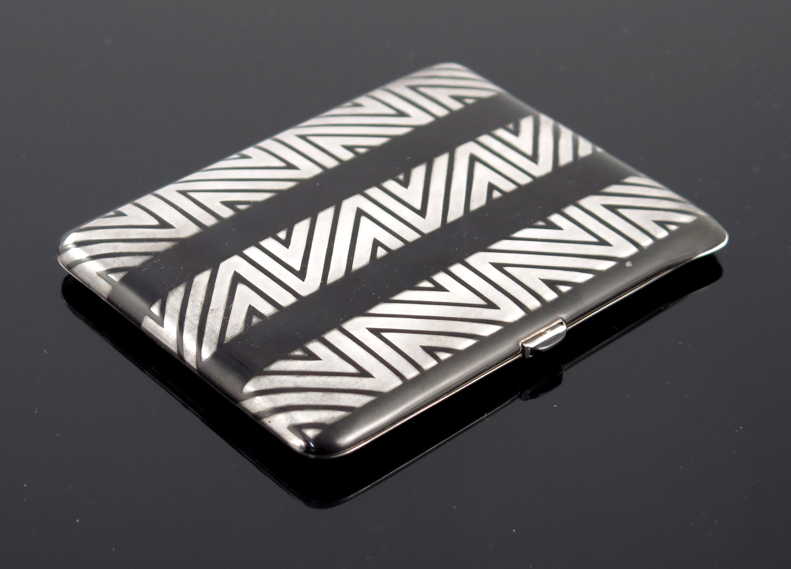 A French Art Deco silver and enamelled cigarette case