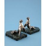 A pair of Art Deco silvered art metal bookends