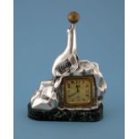 A French Art Deco silvered bronze figural clock