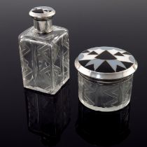 A pair of French Art Deco silver, enamel and cut glass dressing bottles, Andre Delpy, Paris circa 19