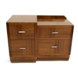 An Art Deco walnut asymmetrical two bay chest