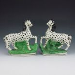 A pair of Staffordshire flatback horses, circa 1860, modelled standing on oval bases, with spotted d