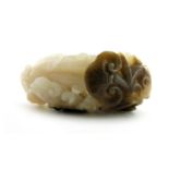 A Chinese pale celadon jade carving of a finger citron and ruyi head, russet brown inclusions, 6.5cm