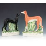 A pair of Staffordshire greyhounds, 'M. Grath' and 'Pretender', circa 1871, modelled standing on gra
