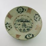 A Chinese provincial dish, the inner decorated with seals in iron red and pagoda landscapes in green