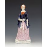 A Staffordshire figure of Florence Nightingale, titled 'Miss F Nightingale', circa 1855, modelled st